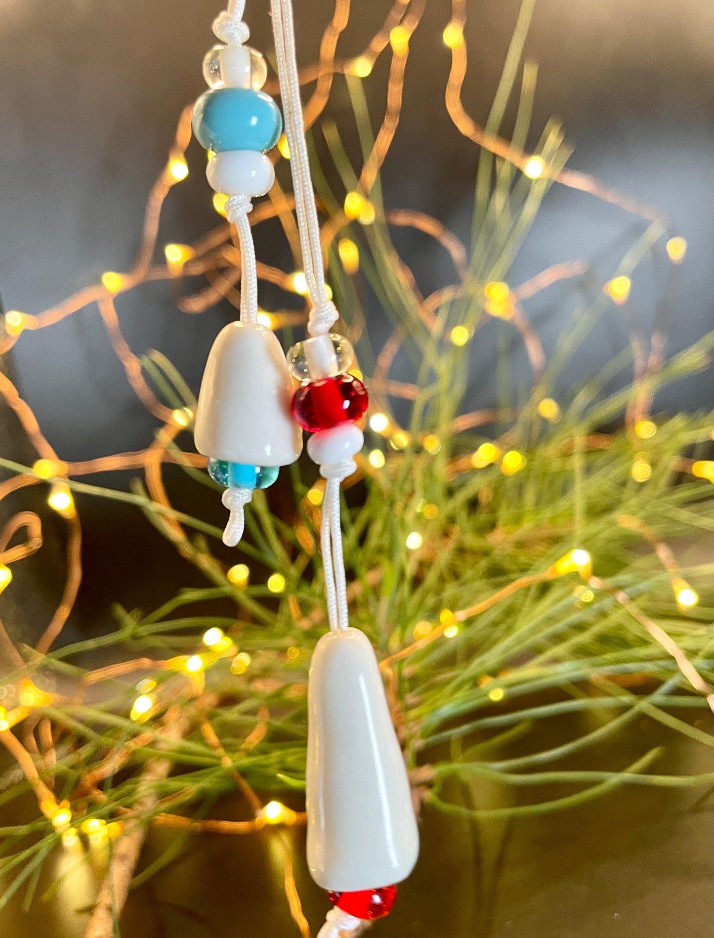 Delicate porcelain bells, often used as Christmas ornaments, showcasing the beauty of porcelain craftsmanship and the joy of festive decorations.