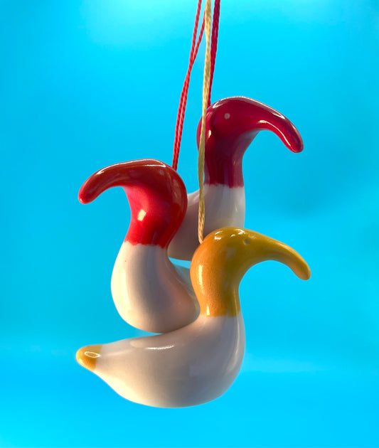 Three small ceramic decorations depicting an Australian White Ibis, also known as a Bin Chicken. Great for Easter or Christmas presents or decorations. Red, yellow and orange.