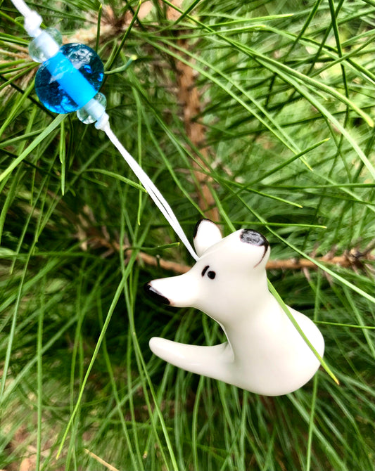 White ceramic kangaroo ornament, suspended from a Christmas tree surrounded by glass beads, creating a unique and enchanting holiday display that combines Australian culture with festive cheer.